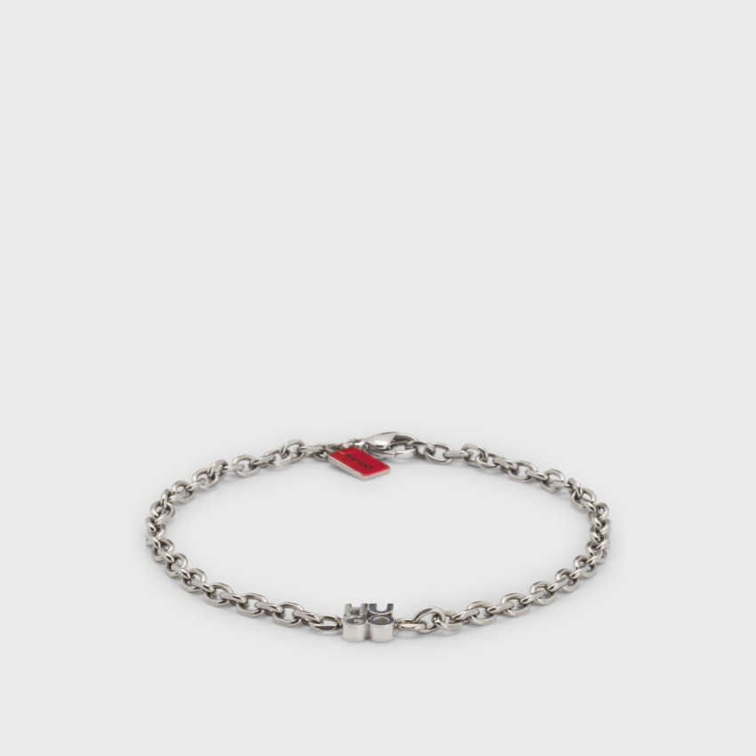 Chain cuff with stacked-logo plaque