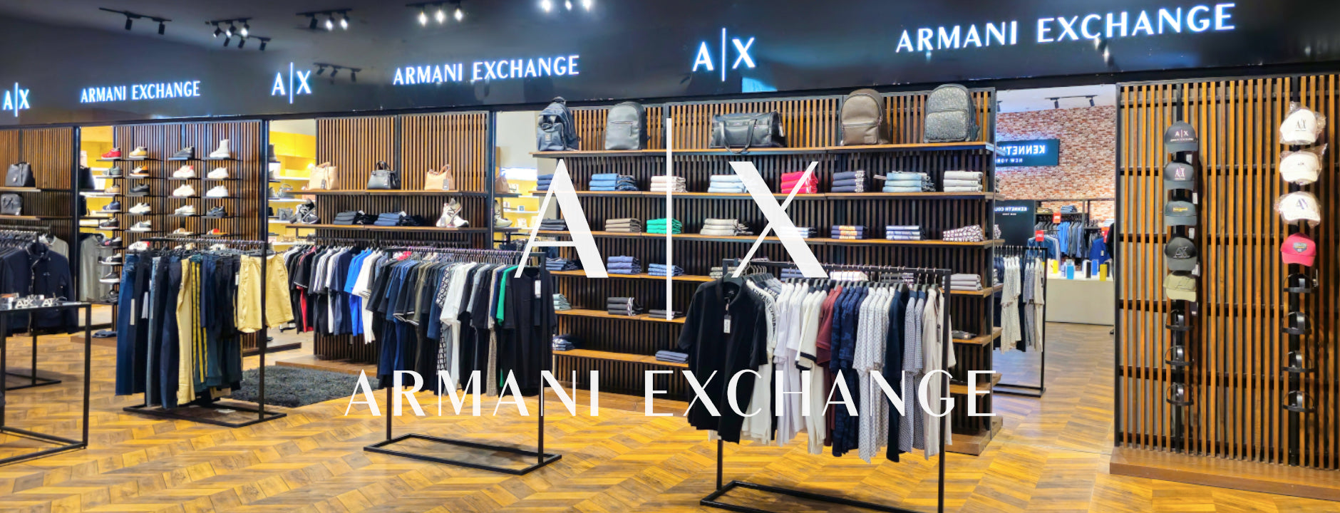 Armani Exchange store interior with clothing racks and branded signs.